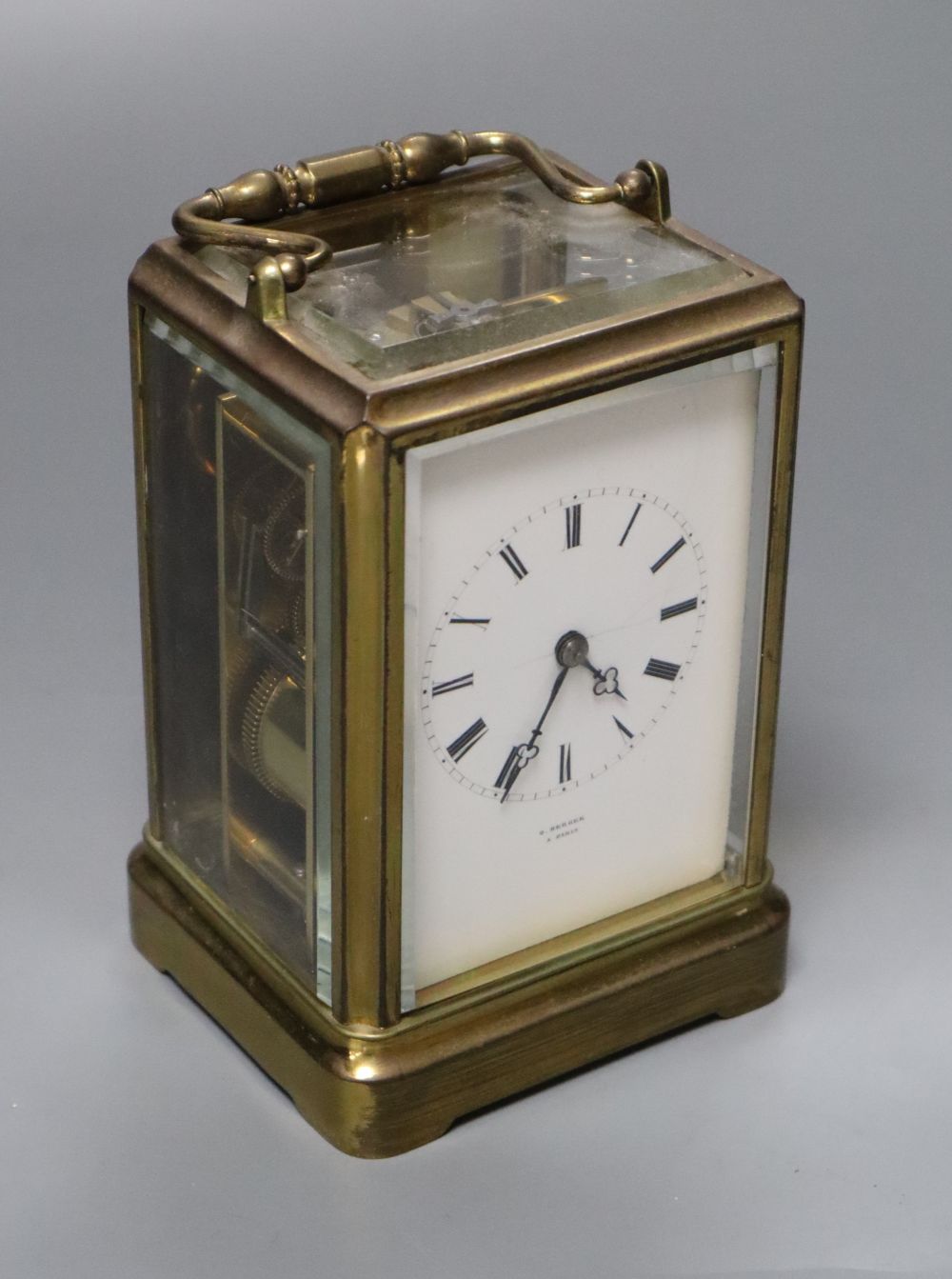 O. Berger, Paris. A carriage clock, with white enamel dial, Japy Freres movement striking on a bell, 19cm incl. handle